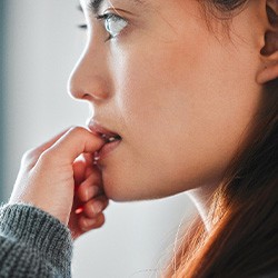 Closeup of woman biting their nails