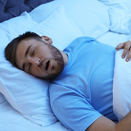 Man in blue shirt with sleep apnea in Savannah, GA
