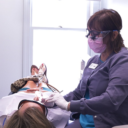 Dental team member answering phone