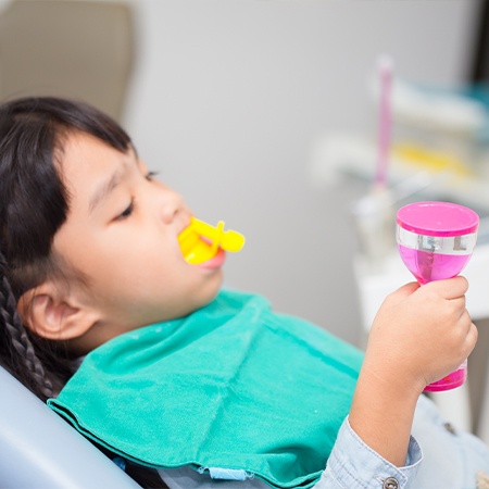 Child receiving fluoride treatment