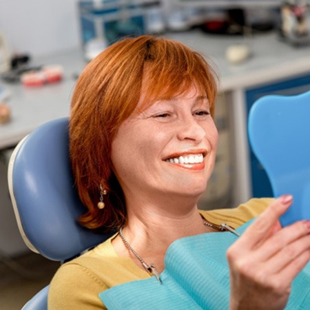 A woman enjoying her dentures in Savannah