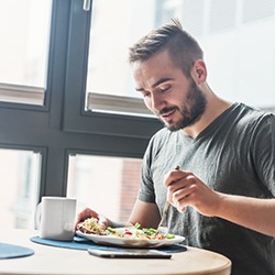 man eating food