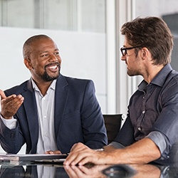 two professional men talking