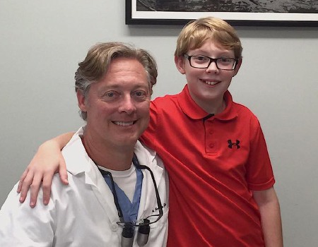 Dr. Fana and young patient smiling