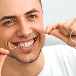 man flossing