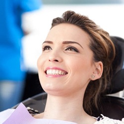 woman at a checkup with her implant dentist in Savannah