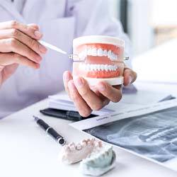Dentist explaining cost of dental implants in Savannah
