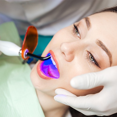 Patient receiving dental sealants