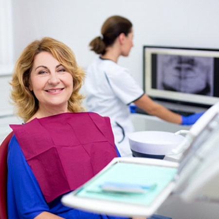 An older woman visiting an emergency dentist in Savannah.