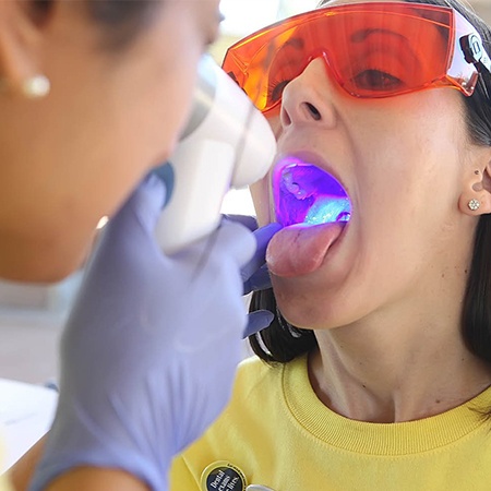 Patient receiving oral cancer screening