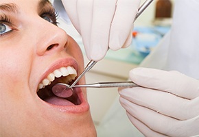 Woman receiving dental exam