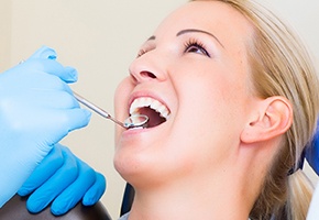 Woman receiving dental treatment