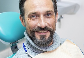 Smiling man in dental chair