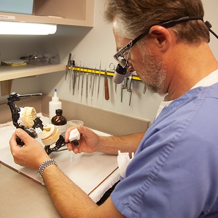 Hand holding an occlusal splint