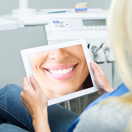 Woman looking at virtual smile design