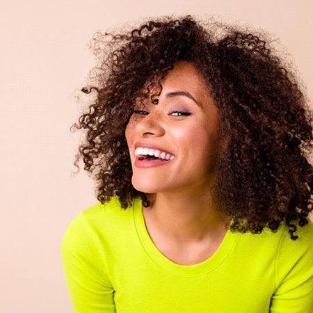 a woman smiling with veneers in Savannah