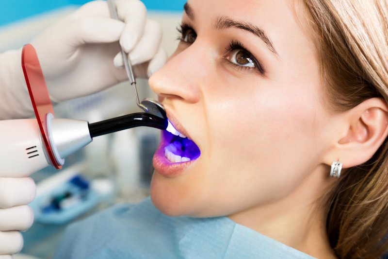 woman at dentist getting dental filling