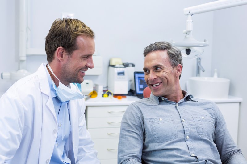 patient speaking to dentist at cosmetic dental consultation