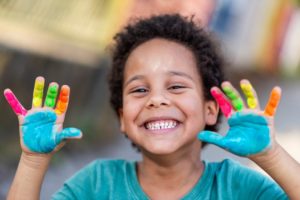 young boy in school coloring a picture