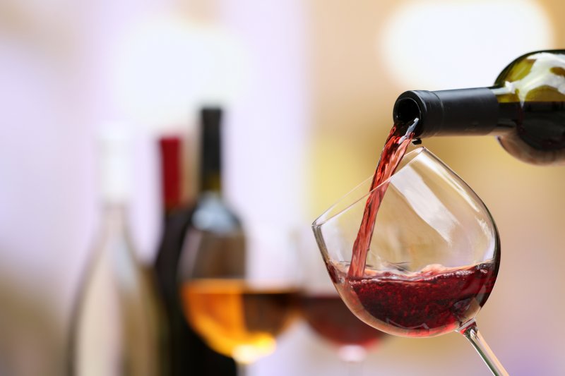 Red wine, which has tannins that cause tooth stains