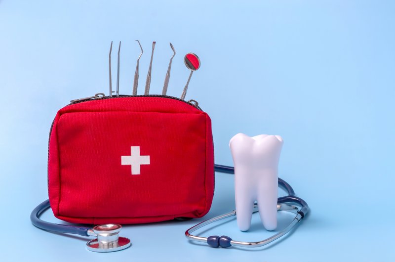 dental emergency kit next to a tooth