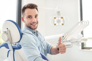 Smiling man giving a thumbs up after his root canal